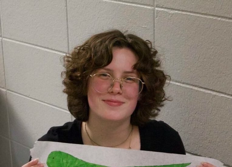 A person holding a piece of paper  AI-generated content may be incorrect.